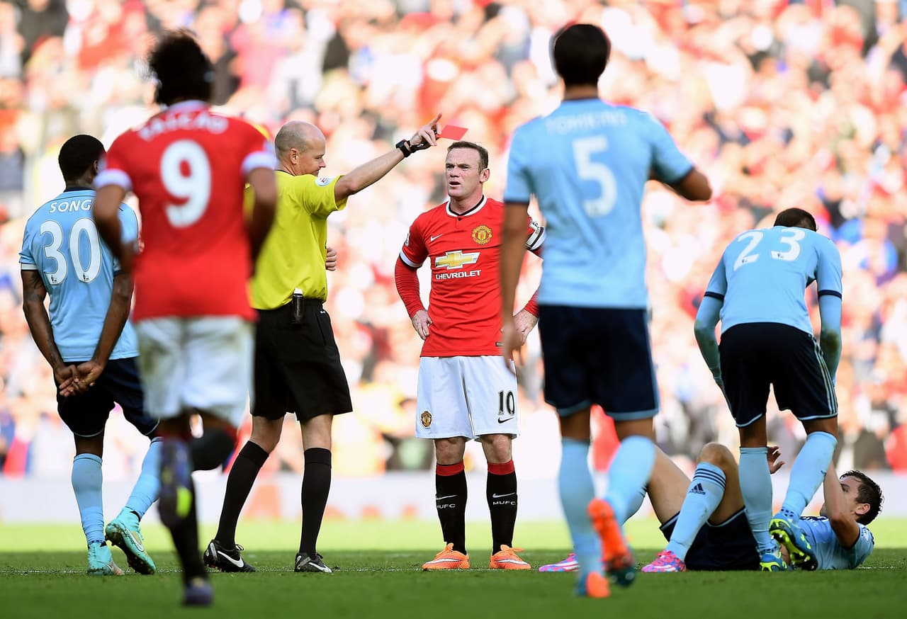 MANCHESTER, ENGLAND - SEPTEMBER 27: Wayne Rooney of Manchester United receives a straight red card by referee Lee Mason after a foul on Stewart Downing of West Ham during the Barclays Premier League match between Manchester United and West Ham United at Old Trafford on September 27, 2014 in Manchester, England. (Photo by Laurence Griffiths/Getty Images)