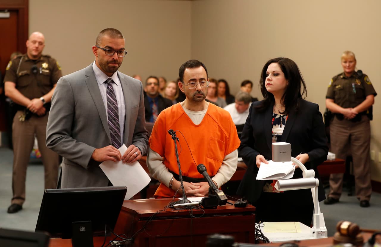 Dr. Larry Nassar, 54, appears in court for a plea hearing in Lansing, Mich., Wednesday, Nov. 22, 2017. Nasser, a sports doctor accused of molesting girls while working for USA Gymnastics and Michigan State University, pleaded guilty to multiple charges of sexual assault and will face at least 25 years in prison. (AP Photo/Paul Sancya)