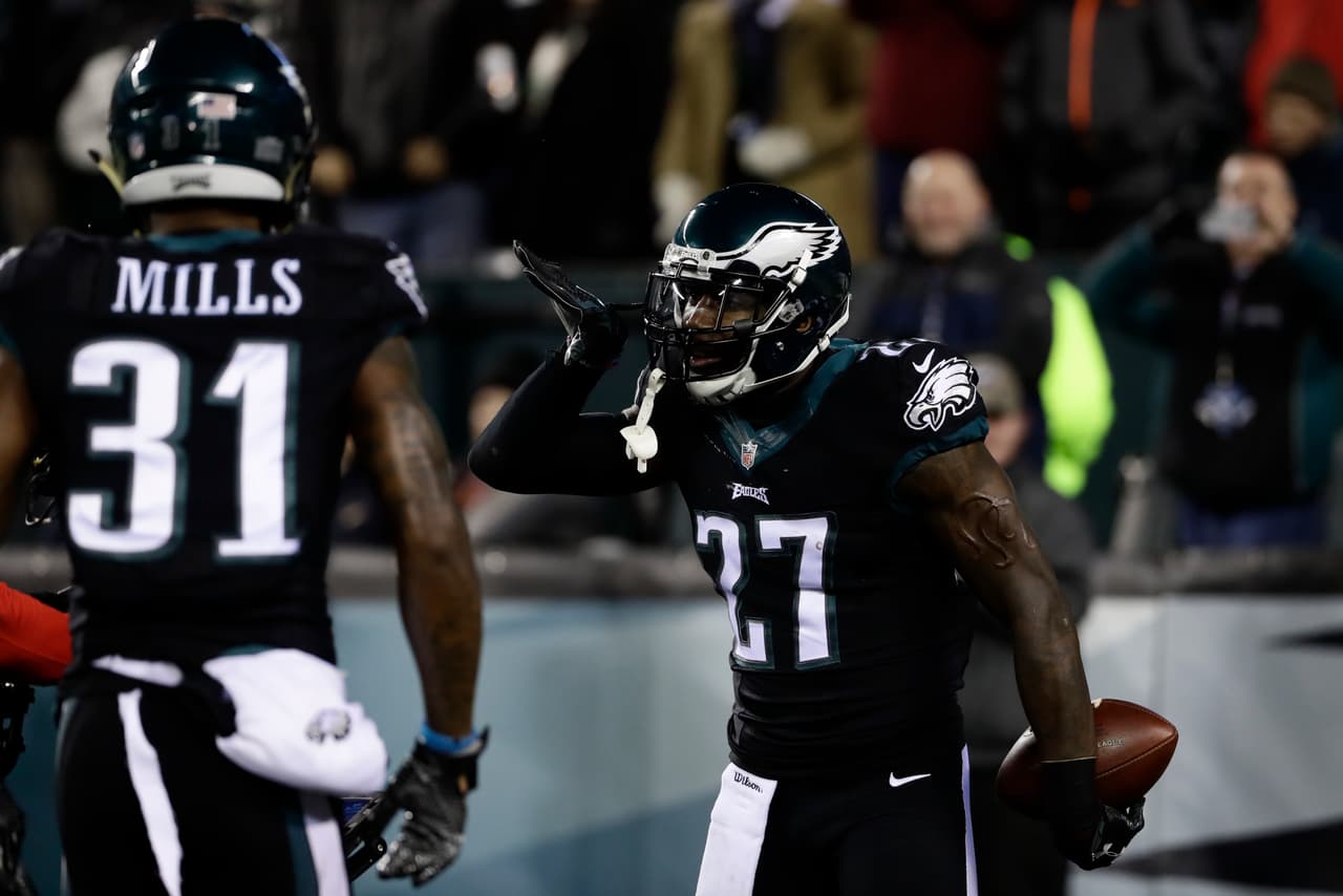Philadelphia Eagles' Malcolm Jenkins (27) celebrates with Jalen Mills (31) after Jenkins intercepted a pass for a touchdown during the first half of an NFL football game against the New York Giants, Thursday, Dec. 22, 2016, in Philadelphia. (AP Photo/Michael Perez)