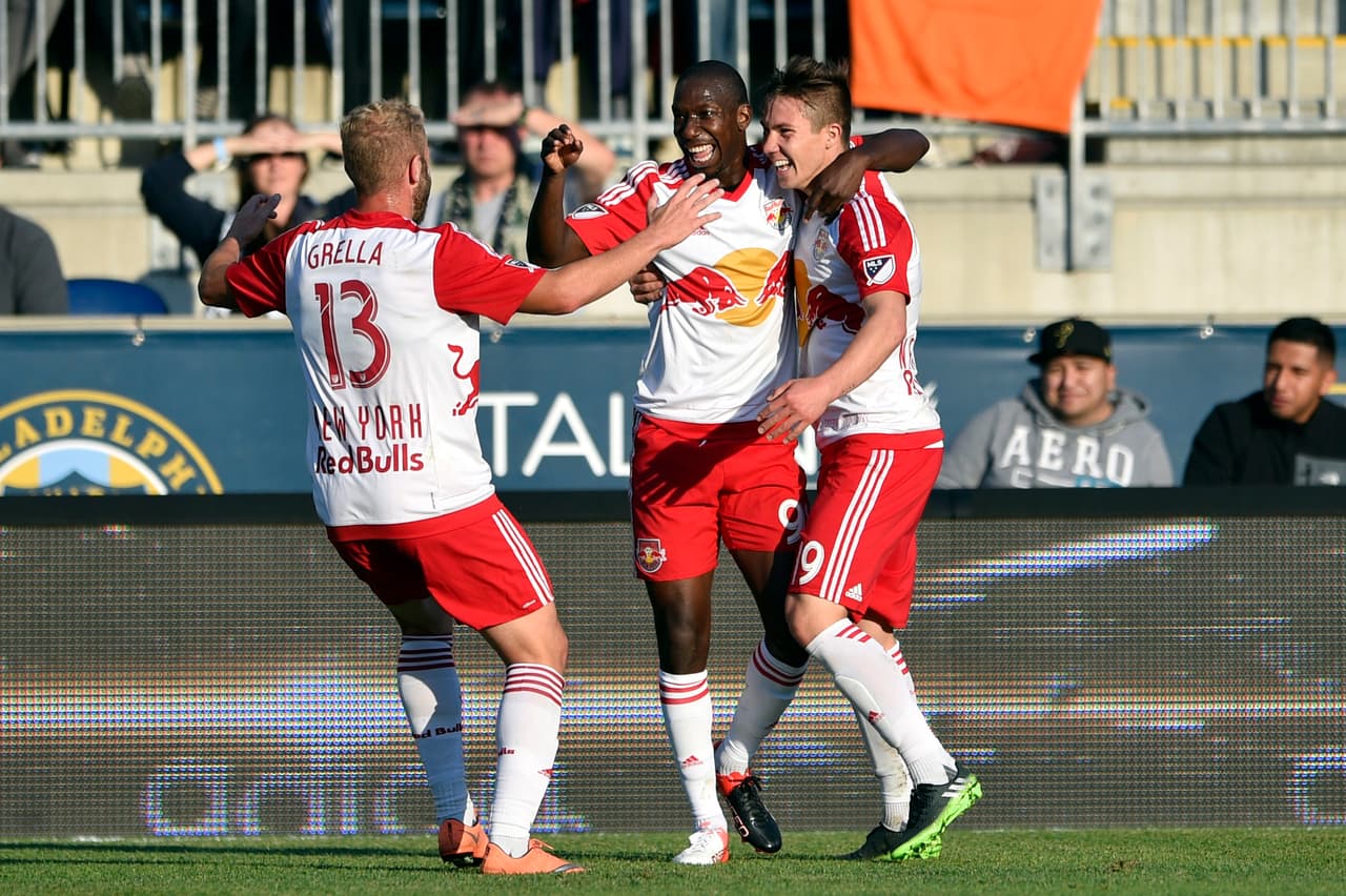 Oct 23, 2016; Philadelphia, PA, USA; New York Red Bulls forward Bradley Wright-Phillips (99) celebrates his goal with midfielder Alex Muyl (19) and forward Mike Grella (13) during the first half against the Philadelphia Union at Talen Energy Stadium. Mandatory Credit: Derik Hamilton-USA TODAY Sports
