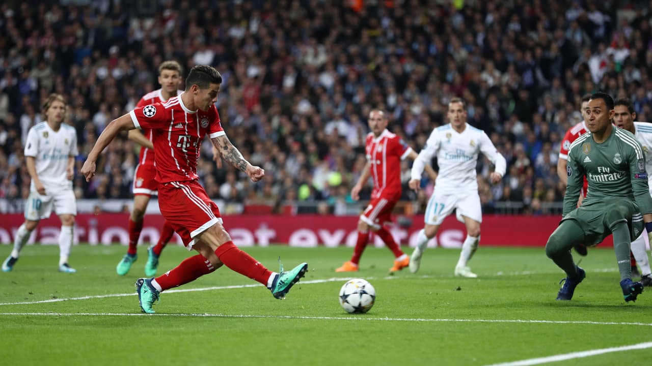 MADRID, SPAIN - MAY 01: James Rodriguez of Bayern Muenchen scores his sides second goal past Keylor Navas of Real Madrid during the UEFA Champions League Semi Final Second Leg match between Real Madrid and Bayern Muenchen at the Bernabeu on May 1, 2018 in Madrid, Spain. (Photo by Lars Baron/Bongarts/Getty Images)