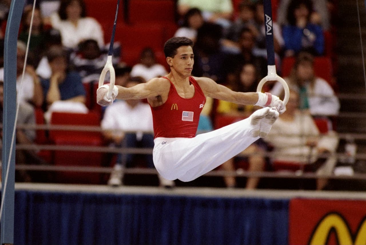 Las barras horizontales en Barcelona 92 fueron el reino de Trent Dimas, quien ganó medalla de oro. El gimnasta fue el primer hispanoamericano en ganar un oro en esta disciplina.
