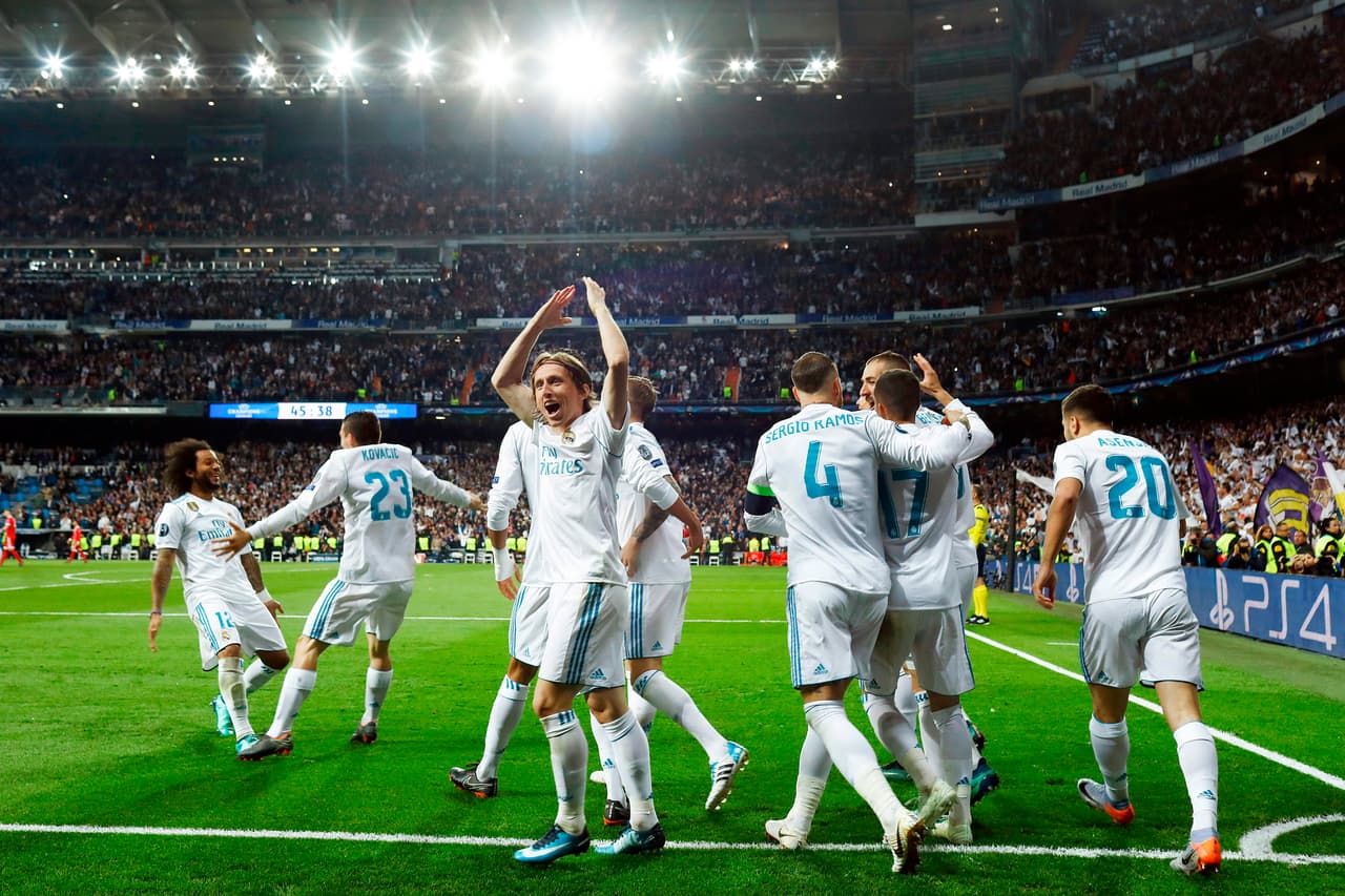 Real Madrid's players celebrate their second goal during the UEFA Champions League semi-final second leg football match between Real Madrid and Bayern Munich at the Santiago Bernabeu Stadium in Madrid on May 1, 2018. (Photo by OSCAR DEL POZO / AFP) (Photo credit should read OSCAR DEL POZO/AFP/Getty Images)