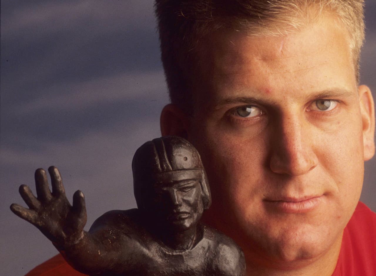 Gino Torretta (1992 con Miami) - Torretta fue una selección de séptima ronda de los Minnesota Vikings en el Draft de 1993. Participó en un partido para los Vikings en 1993, y luego apareció en otro juego en la NFL (para los Seattle Seahawks en 1996) después de no volver a ver acción a nivel profesional.