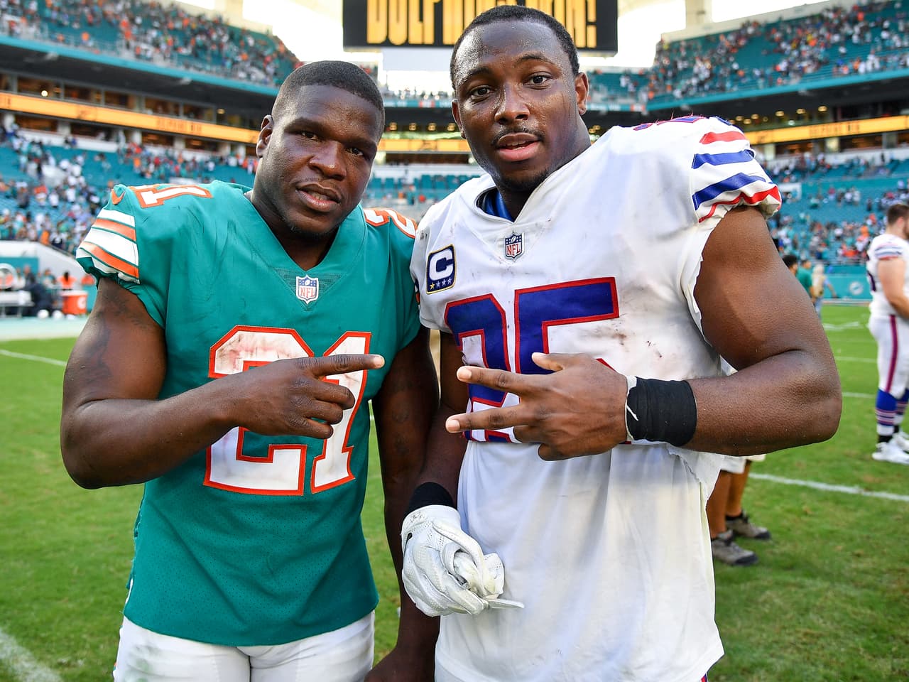 Frank Gore #21 of the Miami Dolphins and LeSean McCoy #25 of the Buffalo Bills after the game at Hard Rock Stadium on December 2, 2018 in Miami, Florida.