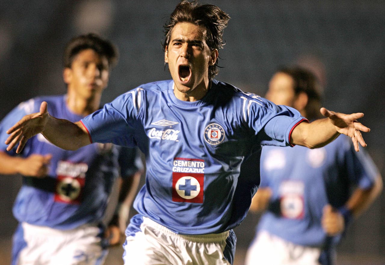 Mexico City, MEXICO: Cesar Delgado of Cruz Azul celebrates his goal against Santos, 15 March,2006 during their "Torneo Clausura 2006" match at Cruz Azul stadium in Mexico City. AFP PHOTO Luis ACOSTA (Photo credit should read LUIS ACOSTA/AFP/Getty Images)