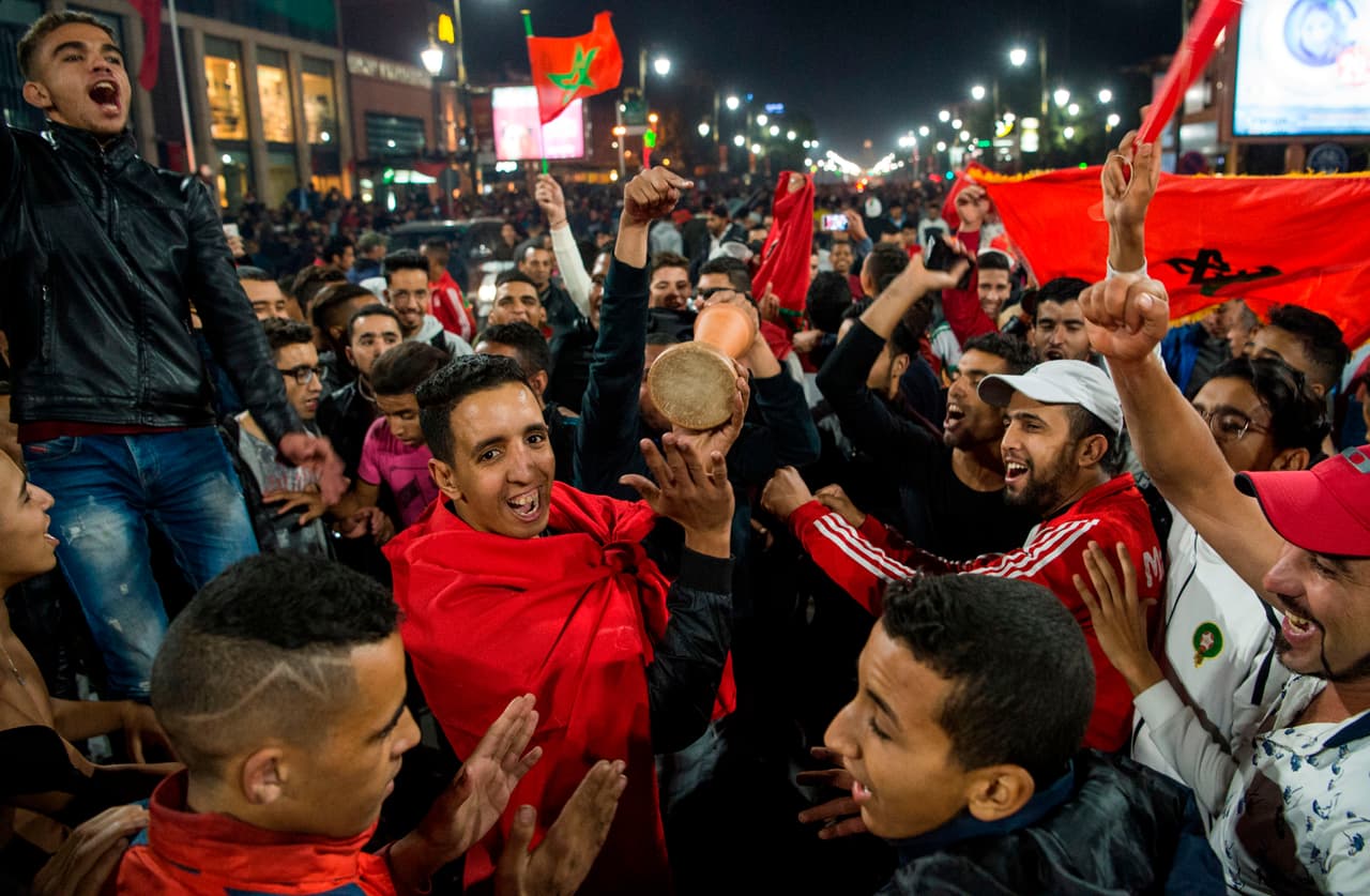 Moroccans celebrate November 11, 2017 in Marrakech following Morocco's victory over Ivory Coast in their FIFA 2018 World Cup Africa Qualifier to participate the FIFA 2018 World Cup. / AFP PHOTO / Fadel SENNA (Photo credit should read FADEL SENNA/AFP/Getty Images)
