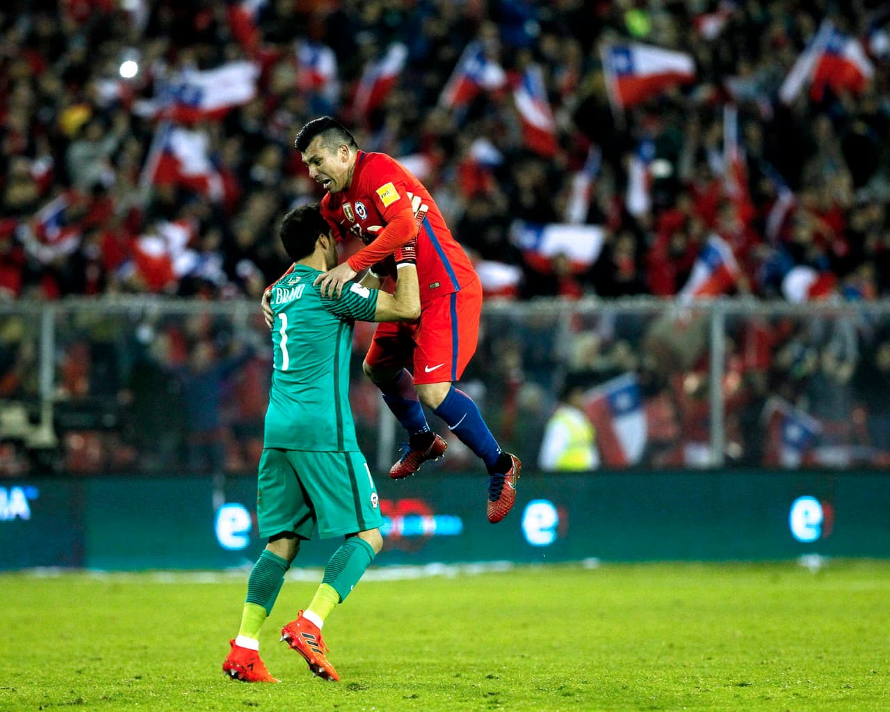 Chile's goalkeeper Claudio Bravo (L) and Gary Medel celebrates after teammate Alexis Sanchez scored against Ecuador during their 2018 World Cup qualifier football match in Santiago on October 5, 2017. / AFP PHOTO / Claudio Reyes (Photo credit should read CLAUDIO REYES/AFP/Getty Images)