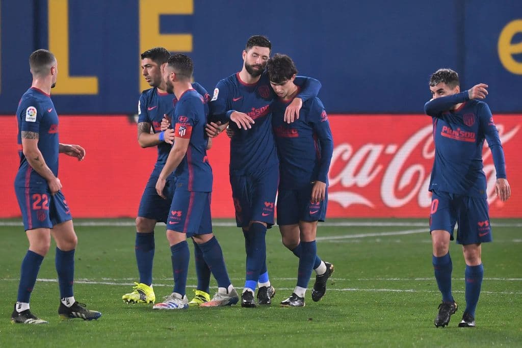 Atletico Madrid's Portuguese midfielder Joao Felix (2R) celebrates with teammates after scoring during the Spanish league football match between Villarreal CF and Club Atletico de Madrid at La Ceramica stadium in Vila-real on February 28, 2021. (Photo by JOSE JORDAN / AFP) (Photo by JOSE JORDAN/AFP via Getty Images)