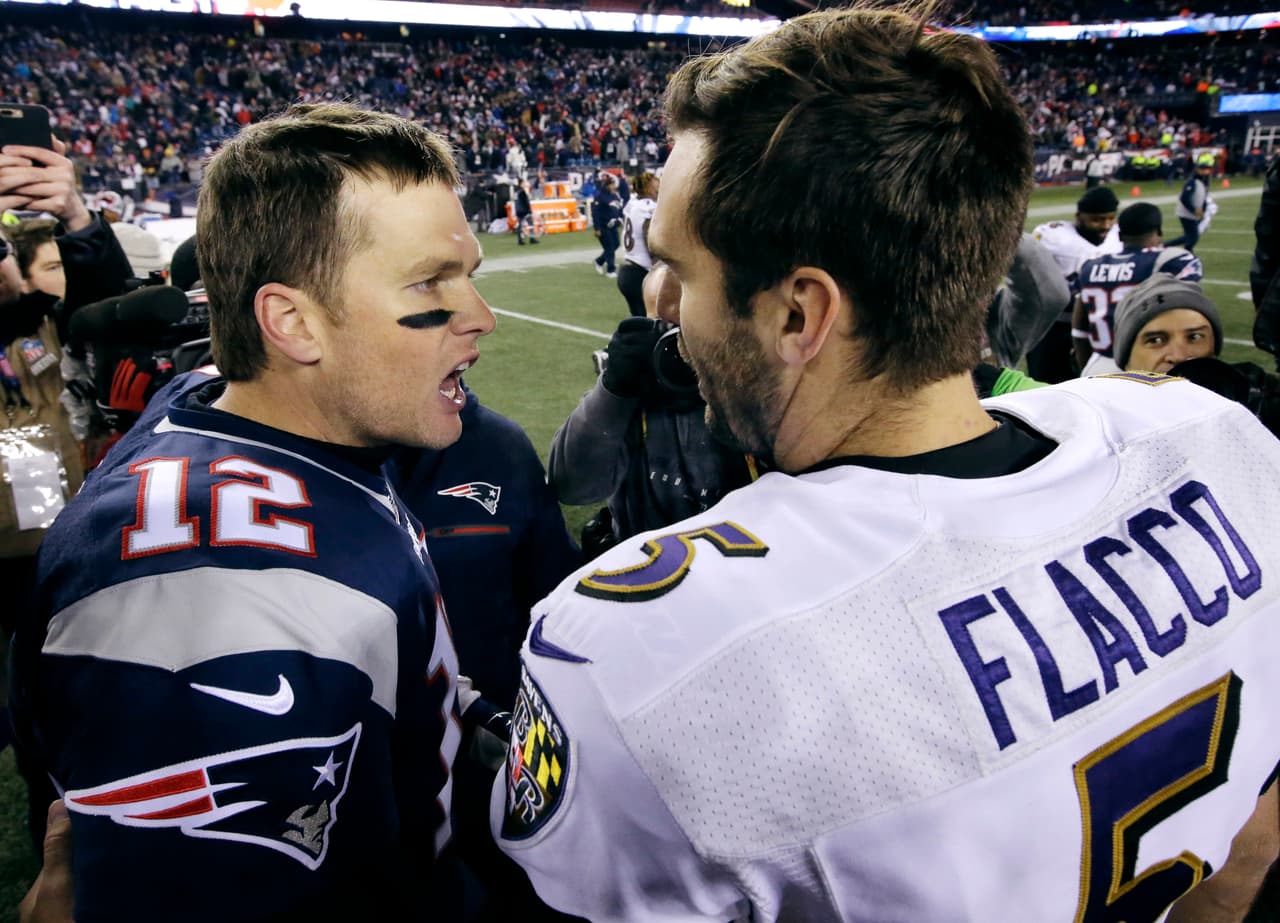 New England Patriots quarterback Tom Brady (12) and Baltimore Ravens quarterback Joe Flacco (5) speak at midfield after an NFL football game, Monday, Dec. 12, 2016, in Foxborough, Mass. (AP Photo/Steven Senne)