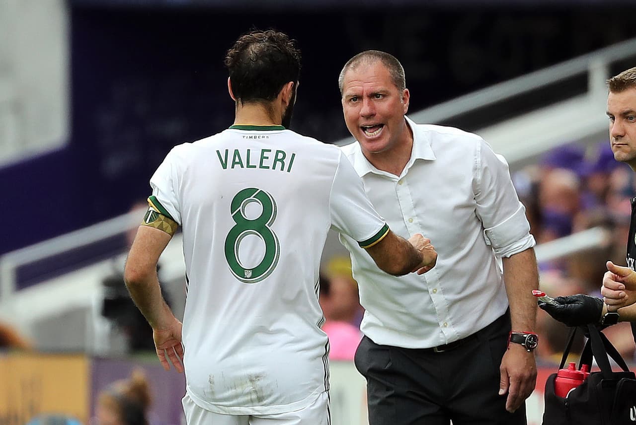 Apr 8, 2018; Orlando, FL, USA; Portland Timbers head coach Giovanni Savarese talks with midfielder Diego Valeri (8) against the Orlando City SC during the second half at Orlando City Stadium. Mandatory Credit: Kim Klement-USA TODAY Sports