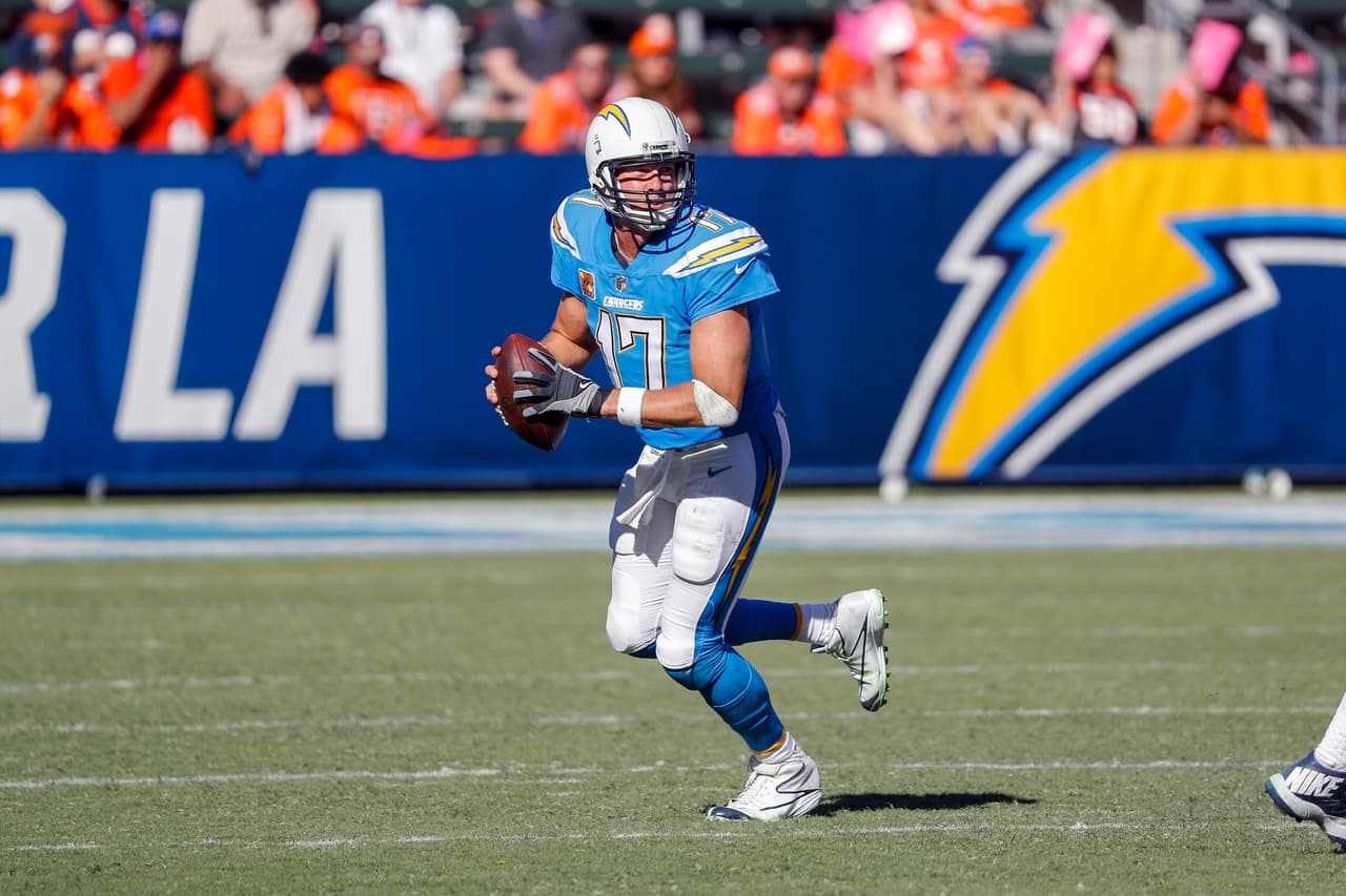 Los Angeles Chargers quarterback Philip Rivers looks downfield as he rolls out to pass in action against the Denver Broncos during an NFL football game on Sunday, Oct. 22, 2017 in Carson, Calif. The Chargers defeated the Broncos 21-0. (G. Newman Lowrance via AP)