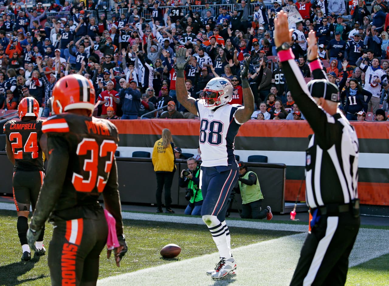 New England Patriots tight end Martellus Bennett (88) celebrates his touchdown catch against Cleveland Browns free safety Jordan Poyer (33) in the second half of an NFL football game Sunday, Oct. 9, 2016, in Cleveland. (AP Photo/Ron Schwane)
