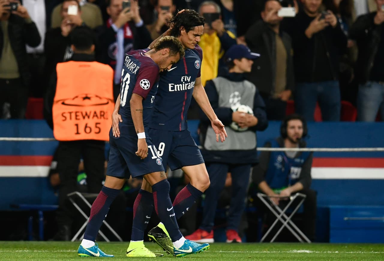 Paris Saint-Germain's Brazilian forward Neymar (L) and Paris Saint-Germain's Uruguayan forward Edinson Cavani react during the UEFA Champions League football match between Paris Saint-Germain and Bayern Munich on September 27, 2017 at the Parc des Princes stadium in Paris. / AFP PHOTO / CHRISTOPHE SIMON (Photo credit should read CHRISTOPHE SIMON/AFP/Getty Images)