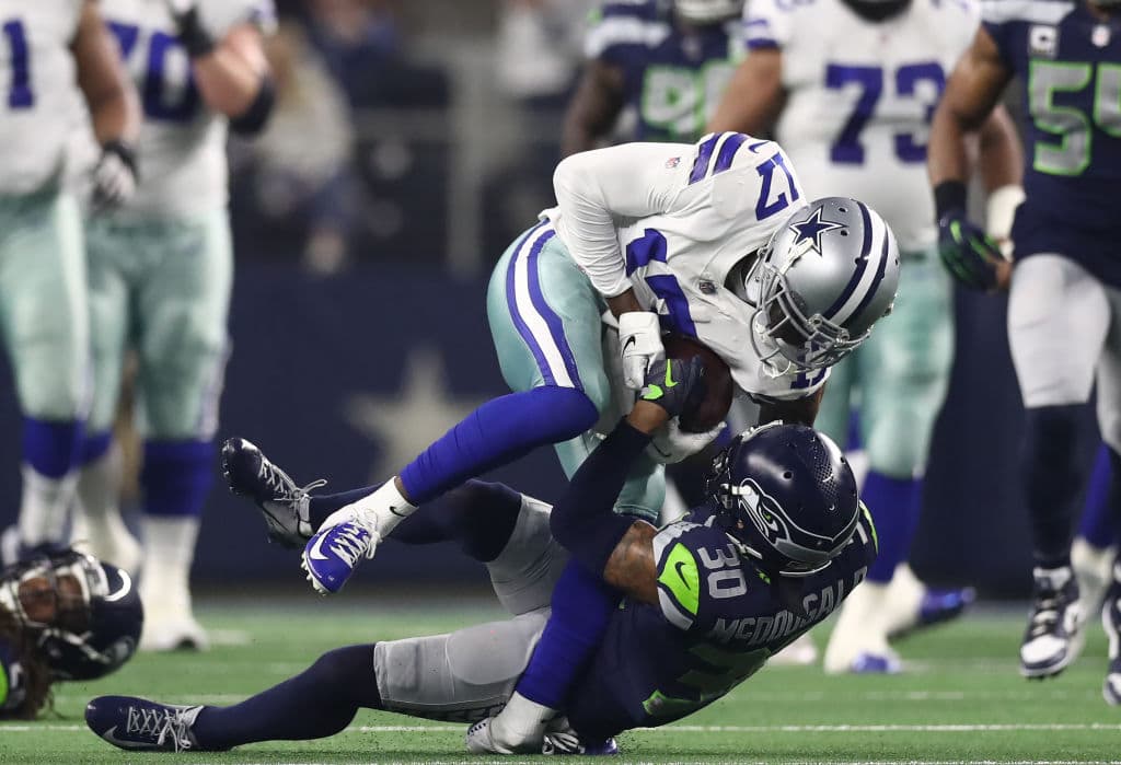 ARLINGTON, TEXAS - JANUARY 05: Allen Hurns #17 of the Dallas Cowboys suffers a leg injury while tackled by Bradley McDougald #30 of the Seattle Seahawks in the first quarter of the Wild Card Round at AT&T Stadium on January 05, 2019 in Arlington, Texas. (Photo by Ronald Martinez/Getty Images)