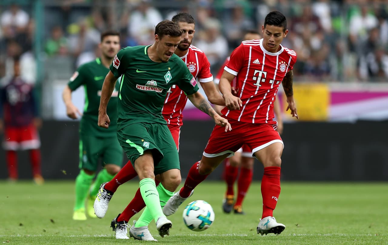 MOENCHENGLADBACH, GERMANY - JULY 15: Max Kruse of Bremen is challenged by James Rodriguez of Muenchen during the Telekom Cup 2017 Final between SV Werder Bremen and FC Bayern Muenchen at Borussia Park on July 15, 2017 in Moenchengladbach, Germany. (Photo by Lars Baron/Bongarts/Getty Images)