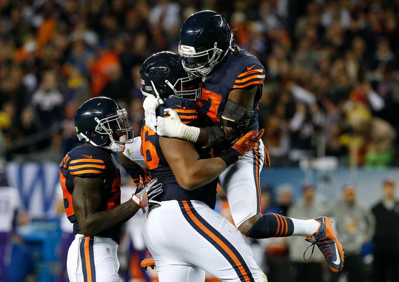 Chicago Bears defensive end Akiem Hicks (96) celebrates his sack on Minnesota Vikings quarterback Sam Bradford (8) with Sherrick McManis (27) during the first half of an NFL football game in Chicago, Monday, Oct. 31, 2016. (AP Photo/Nam Y. Huh)