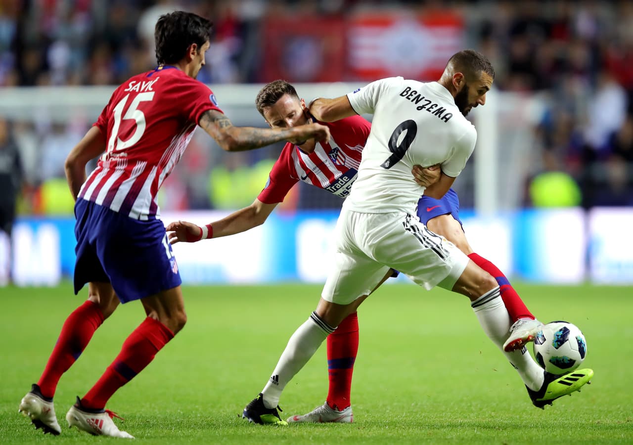 TALLINN, ESTONIA - AUGUST 15: Karim Benzema of Real Madrid and Saul Niguez of Atletico Madrid in action during the UEFA Super Cup between Real Madrid and Atletico Madrid at Lillekula Stadium on August 15, 2018 in Tallinn, Estonia. (Photo by Alexander Hassenstein/Getty Images)