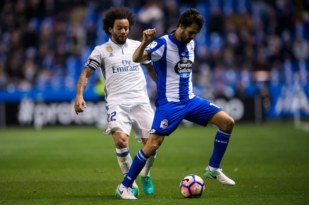 LA CORUNA, SPAIN - APRIL 26: Marcelo Vieira da Silva of Real Madrid duels for the ball with Alejandro Arribas of RC Deportivo La Coruna during the La Liga match between RC Deportivo La Coruna and Real Madrid at Riazor Stadium on April 26, 2017 in La Coruna, Spain. (Photo by Juan Manuel Serrano Arce/Getty Images)