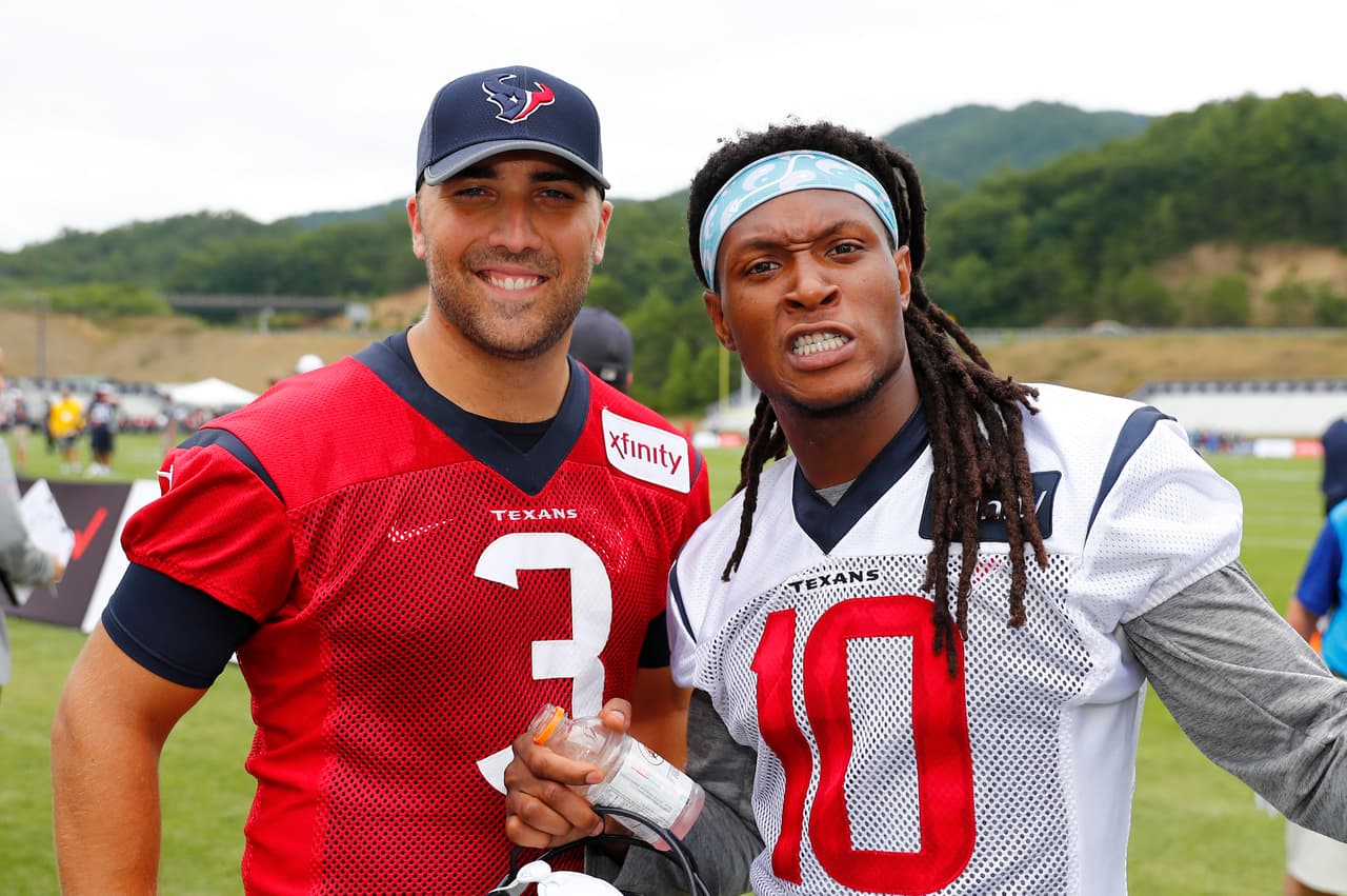 Houston Texans wide receiver DeAndre Hopkins (10) and quarterback Tom Savage (3) after the first day of Houston Texans training camp at the Greenbrier in White Sulphur Springs, West Virginia on July 26, 2017. (Matt Patterson via AP)