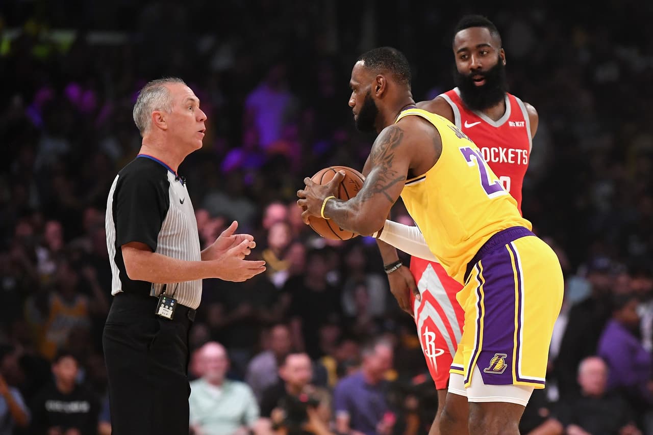 LOS ANGELES, CA - OCTOBER 20: LeBron James #23 of the Los Angeles Lakers checks out the ball from referee Jason Phillips #23 before tip off between the Houston Rockets and the Los Angeles Lakers at Staples Center on October 20, 2018 in Los Angeles, California. (Photo by Harry How/Getty Images)