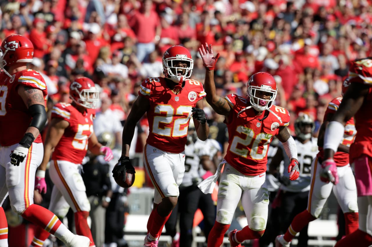Kansas City Chiefs defensive back Marcus Peters (22) and defensive back Steven Nelson (20) celebrate after Peters recovered a fumble by the New Orleans Saints during the second half of an NFL football game in Kansas City, Mo., Sunday, Oct. 23, 2016. (AP Photo/Colin E. Braley)