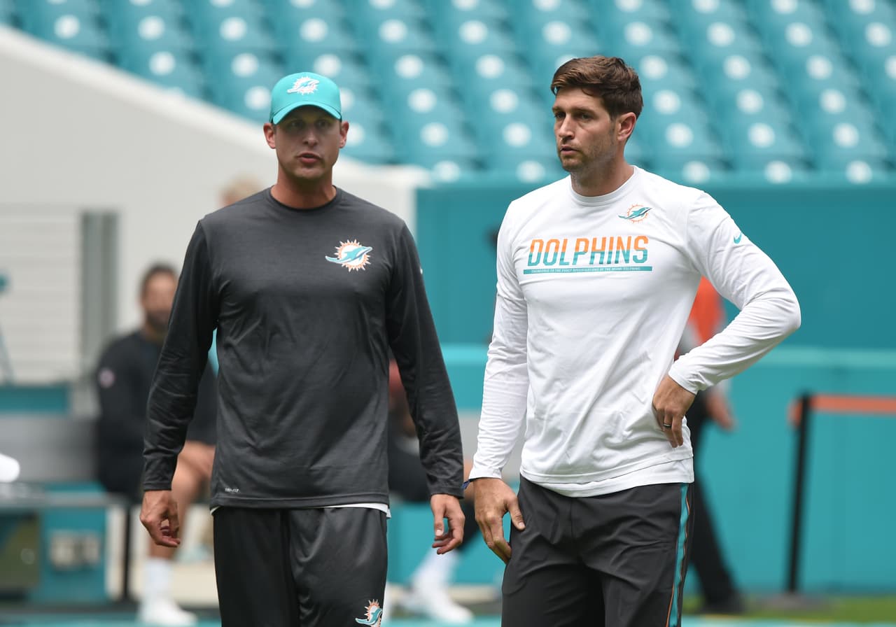 Miami Dolphins coach Adam Gase (left) talks with newly-signed quarterback Jay Cutler before a Thursday, Aug. 10, 2017, week 1 NFL pre-season football game in Miami Gardens, Fla. The Dolphins defeated the Atlanta Falcons 23 - 20. Cutler did not play. (Al Messerschmidt via AP)