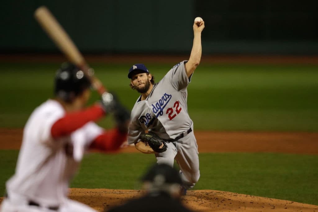 Clayton Kershaw #22 of the Los Angeles Dodgers delivers the pitch during the first inning against the Boston Red Sox in Game One of the 2018 World Series at Fenway Park on October 23, 2018 in Boston, Massachusetts. (Photo by Charles Krupa - Pool/Gettyimages)