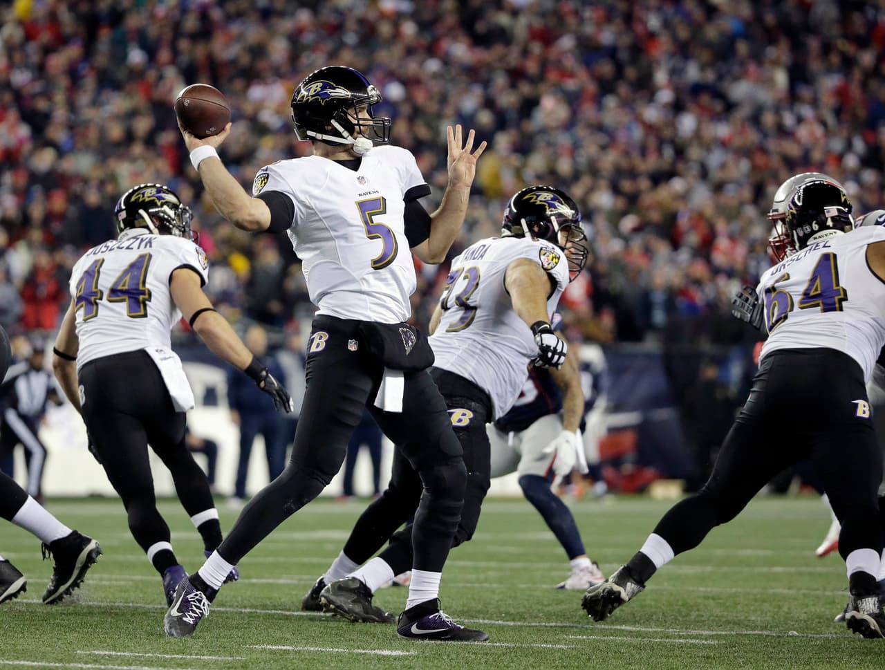 Baltimore Ravens quarterback Joe Flacco (5) passes against the New England Patriots during the first half of an NFL football game, Monday, Dec. 12, 2016, in Foxborough, Mass. (AP Photo/Steven Senne)