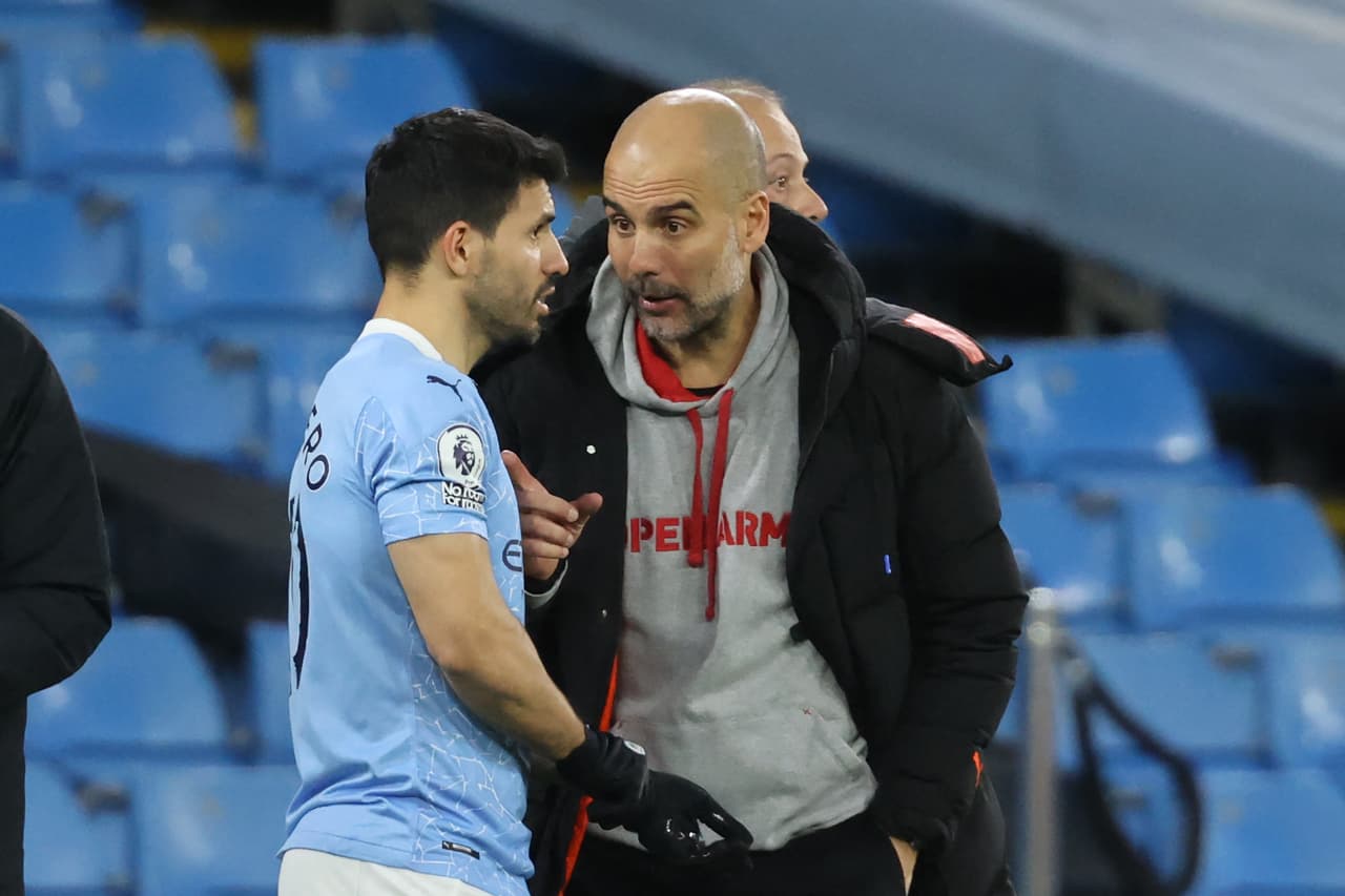 Manchester City's Spanish manager Pep Guardiola (R) briefs Manchester City's Argentinian striker Sergio Aguero during the English Premier League football match between Manchester City and Southampton at the Etihad Stadium in Manchester, north west England on March 10, 2021. - RESTRICTED TO EDITORIAL USE. No use with unauthorized audio, video, data, fixture lists, club/league logos or 'live' services. Online in-match use limited to 120 images. An additional 40 images may be used in extra time. No video emulation. Social media in-match use limited to 120 images. An additional 40 images may be used in extra time. No use in betting publications, games or single club/league/player publications. (Photo by Clive Brunskill / POOL / AFP) / RESTRICTED TO EDITORIAL USE. No use with unauthorized audio, video, data, fixture lists, club/league logos or 'live' services. Online in-match use limited to 120 images. An additional 40 images may be used in extra time. No video emulation. Social media in-match use limited to 120 images. An additional 40 images may be used in extra time. No use in betting publications, games or single club/league/player publications. / RESTRICTED TO EDITORIAL USE. No use with unauthorized audio, video, data, fixture lists, club/league logos or 'live' services. Online in-match use limited to 120 images. An additional 40 images may be used in extra time. No video emulation. Social media in-match use limited to 120 images. An additional 40 images may be used in extra time. No use in betting publications, games or single club/league/player publications. (Photo by CLIVE BRUNSKILL/POOL/AFP via Getty Images)