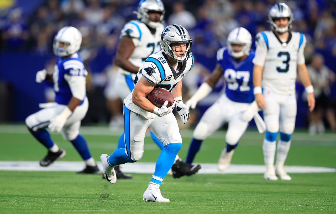 INDIANAPOLIS, INDIANA - DECEMBER 22: Christian McCaffrey #22 of the Carolina Panthers runs with the ball while defended by Clayton Geathers of the Indianapolis Colts at Lucas Oil Stadium on December 22, 2019 in Indianapolis, Indiana. (Photo by Andy Lyons/Getty Images)