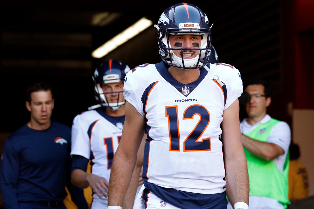 Denver Broncos quarterback Paxton Lynch (12) walks to the field prior to an NFL preseason football game against the San Francisco 49ers, Saturday, Aug. 19, 2017, in Santa Clara, Calif. The Broncos defeated the 49ers 33-14. (Ryan Kang via AP)