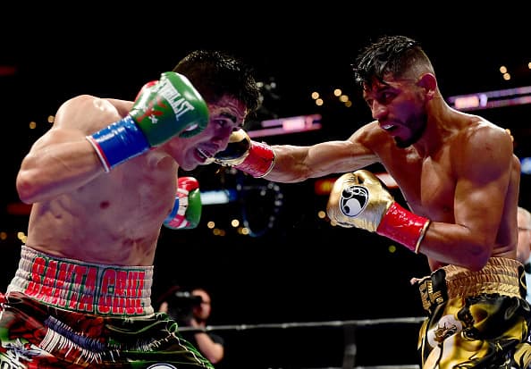LOS ANGELES, CA - AUGUST 29: Abner Mares of Mexico punches Leo Santa Cruz during the seventh round of the WBC diamond featherweight and WBA featherweight championship bout at Staples Center on August 29, 2015 in Los Angeles, California. Santa Cruz would win in a 12 round decision. (Photo by Harry How/Getty Images)