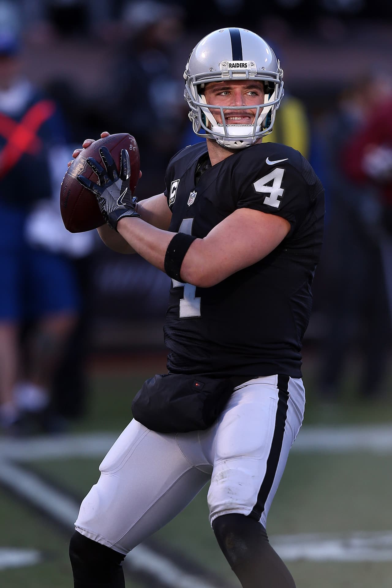 Oakland Raiders quarterback Derek Carr in action against the Indianapolis Colts during an NFL football game Saturday, Dec. 24, 2016, in Oakland, CA. The Raiders won 32-25. (Daniel Gluskoter/AP Images for Panini)