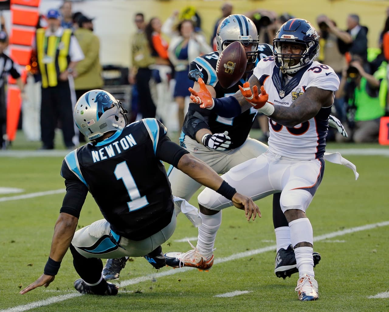FILE - In this Feb. 7, 2016, file photo, Denver Broncos' Von Miller (58) strips the ball from Carolina Panthers' Cam Newton (1) during the first half of the NFL Super Bowl 50 football game, in Santa Clara, Calif. Von Miller got the best of Cam Newton both in the Super Bowl and its aftermath, making the NFL's MVP the butt of his jokes on "SNL" and trolling him on Instagram after sack-stripping him twice in the shadow of the Panthers' goal line. Miller, who was named Super Bowl MVP after his two sack-strips of Newton led to both of Denver's touchdowns in the Broncos' 24-10 win seven months ago, said he lobbed the friendly jabs only because he has immense respect for Newton, whom he called "the best player in the league." Newton, who faces Miller again Thursday night in the 2016 NFL kickoff in Denver, swears he didn't mind Miller rubbing it in. (AP Photo/David J. Phillip, File)