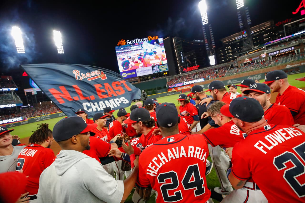 ATLANTA, GA - SEP 20: The Atlanta Braves storm the field at the conclusion of an MLB game against the San Francisco Giants in which they clinched the NL East at SunTrust Park on September 20, 2019 in Atlanta, Georgia. (Photo by Todd Kirkland/Getty Images)