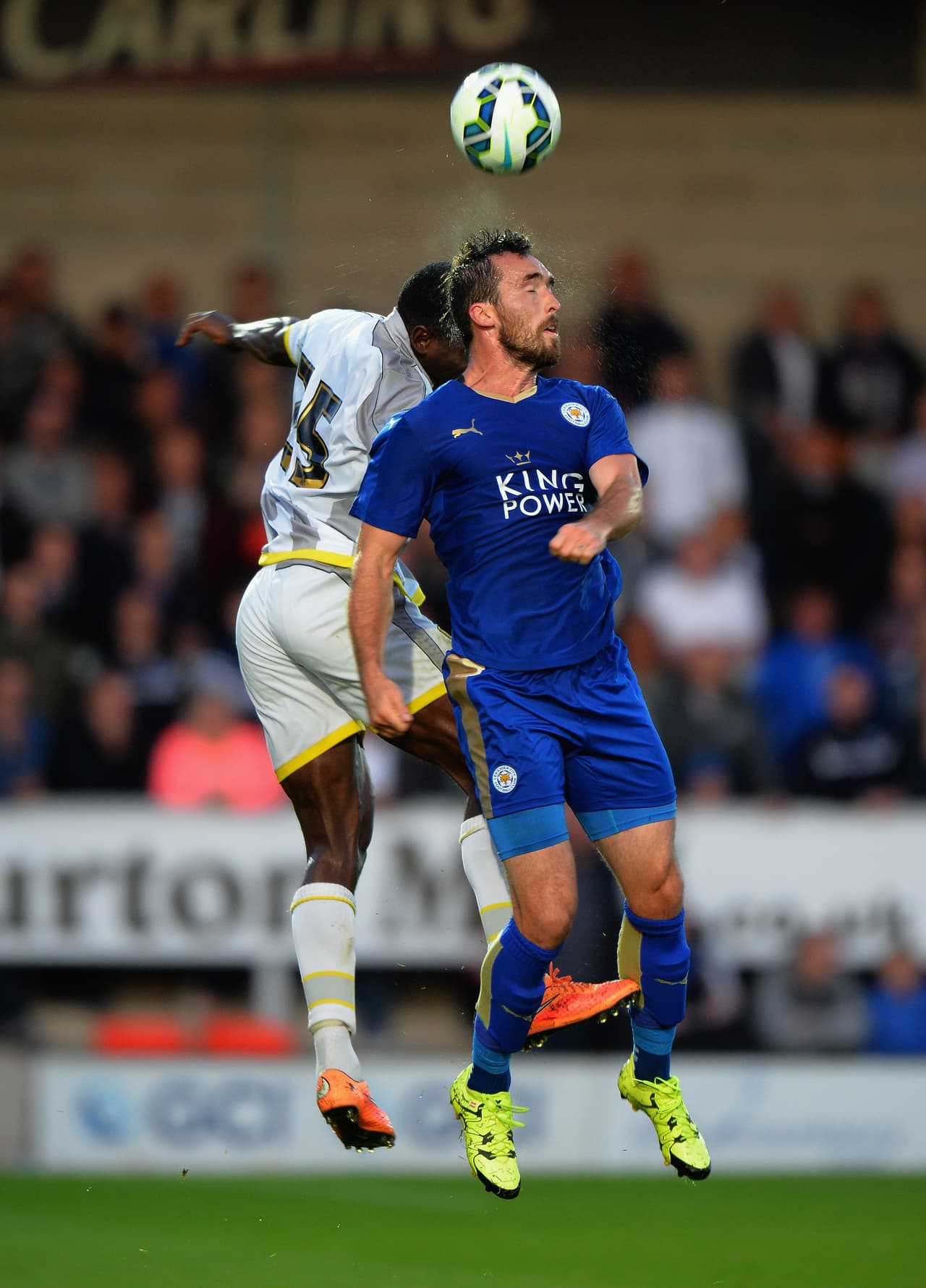 BURTON-UPON-TRENT, ENGLAND - JULY 28: Christian Fuchs of Leicester City challenged by Kelvin Maynard of Burton Albion during the Pre Season Friendly match between Burton Albion and Leicester City at Pirelli Stadium on July 28, 2015 in Burton-upon-Trent, England. (Photo by Tony Marshall/Getty Images)