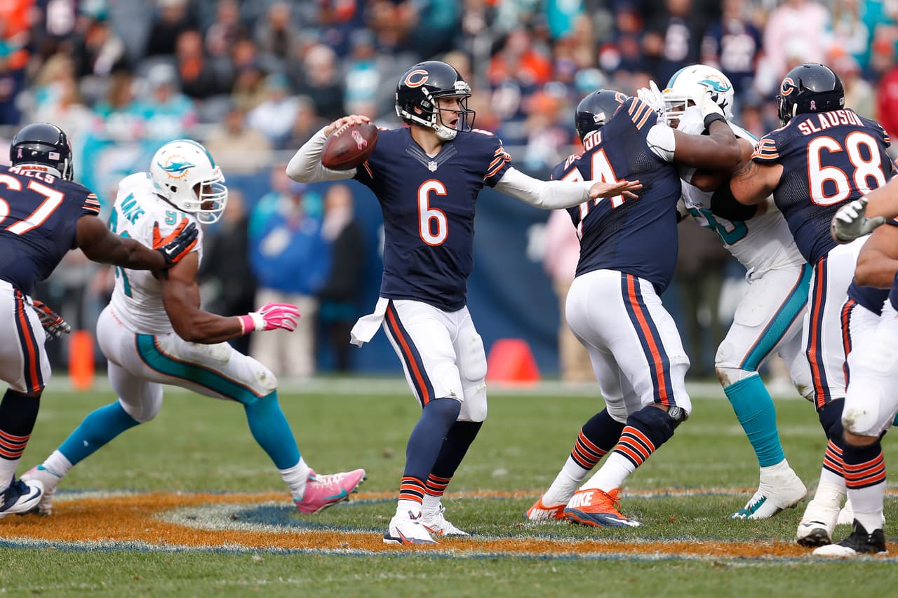 Chicago Bears quarterback Jay Cutler (6) passes the football during a week 7 NFL football game against the Miami Dolphins in Chicago, Illinois on Sunday, October 19, 2014. The Dolphins defeated the Bears 27-14. (AP Photo/Scott Boehm)