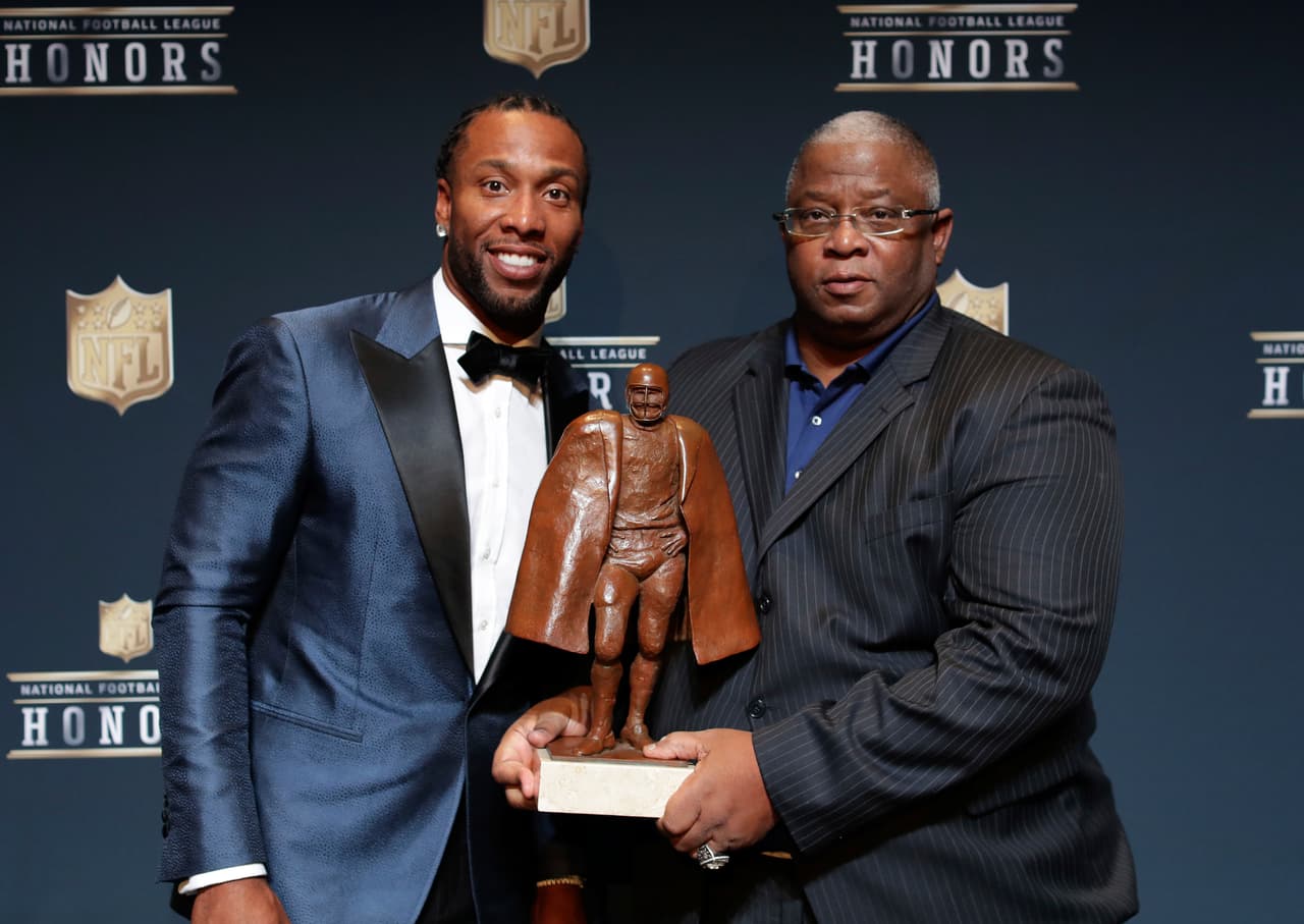 Larry Fitzgerald of the Arizona Cardinals, left, and Larry Fitzgerald Sr. pose in the press room at the 6th annual NFL Honors at the Wortham Center on Saturday, Feb. 4, 2017, in Houston. (Photo by Jeff Lewis/Invision for NFL/AP Images)