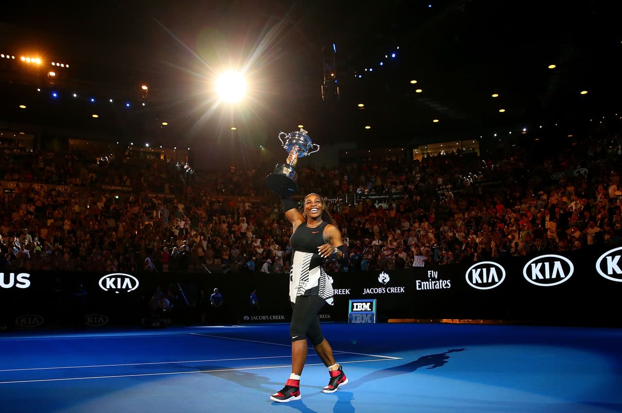 MELBOURNE, AUSTRALIA - JANUARY 28: Serena Williams waves to the crowd as she leaves the court with the Daphne Akhurst Trophy after winning the Women's Singles Final against Venus Williams of the United States on day 13 of the 2017 Australian Open at Melbourne Park on January 28, 2017 in Melbourne, Australia. (Photo by Scott Barbour/Getty Images)