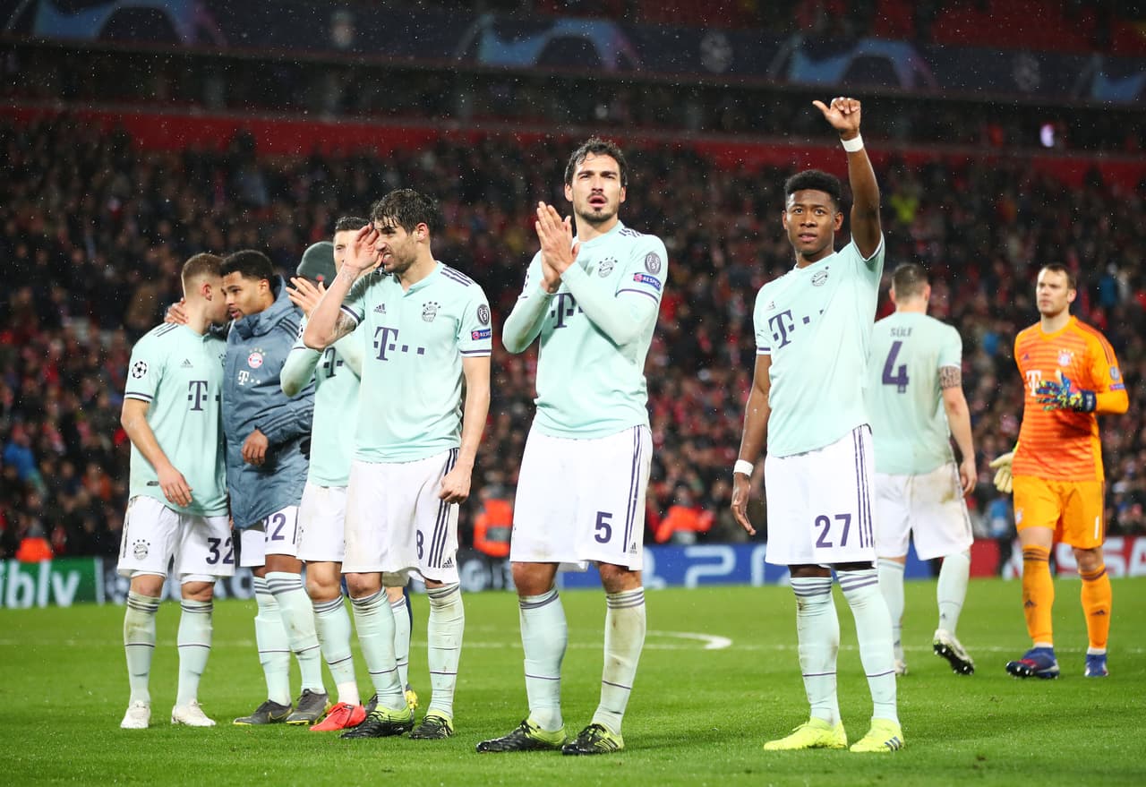 LIVERPOOL, ENGLAND - FEBRUARY 19: Javi Martinez, Mats Hummels and David Alaba of Bayern Munich salute the travelling fans after the UEFA Champions League Round of 16 First Leg match between Liverpool and FC Bayern Muenchen at Anfield on February 19, 2019 in Liverpool, England,