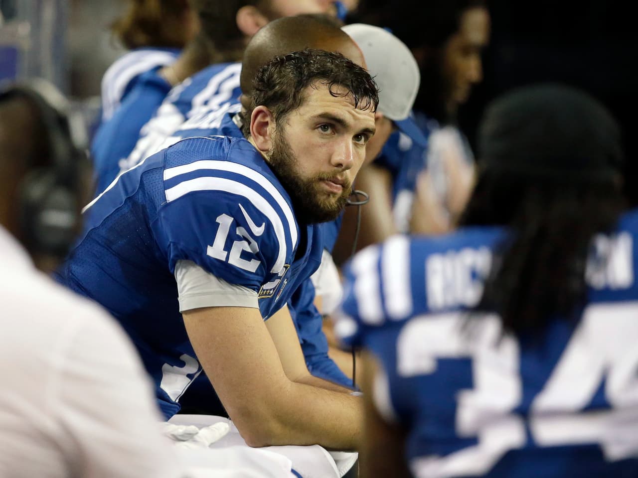 Indianapolis Colts quarterback Andrew Luck (12) sits on the bench during the fourth quarter of an NFL football game against the Dallas Cowboys, Sunday, Dec. 21, 2014, in Arlington, Texas. (AP Photo/Tim Sharp)