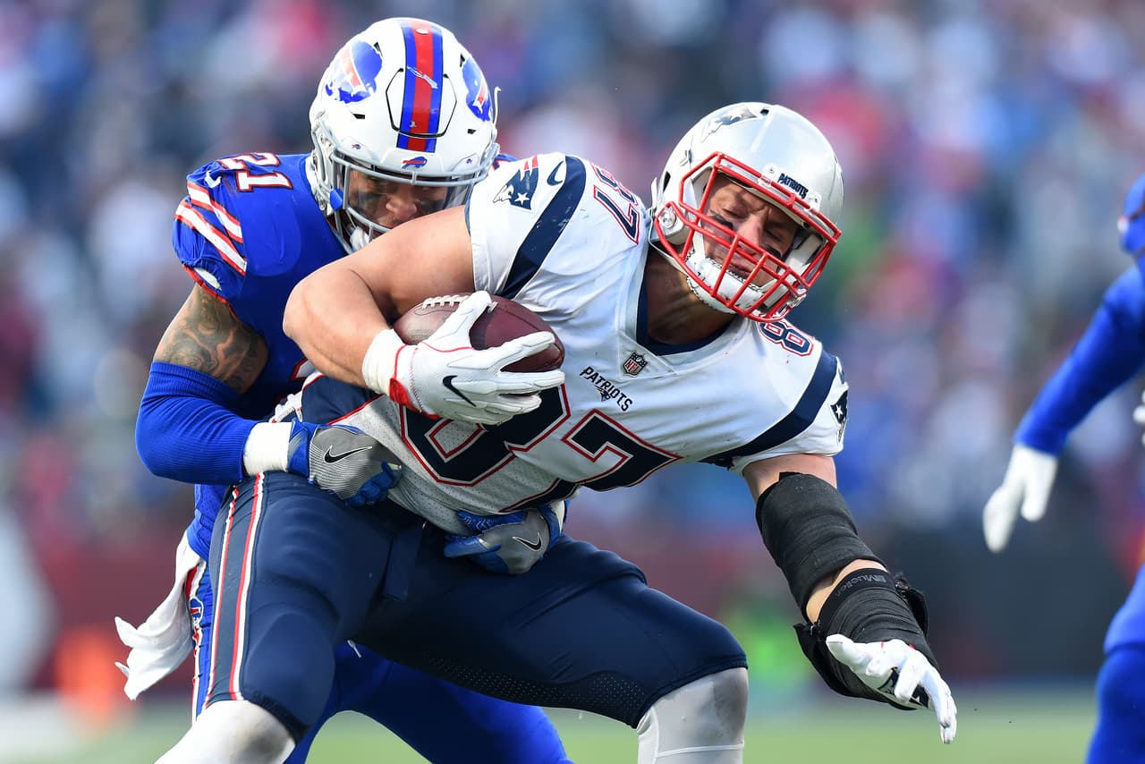 New England Patriots tight end Rob Gronkowski (87) is tackled by Buffalo Bills free safety Jordan Poyer (21) during the second half of an NFL football game, Sunday, Dec. 3, 2017, in Orchard Park, N.Y. (AP Photo/Rich Barnes)