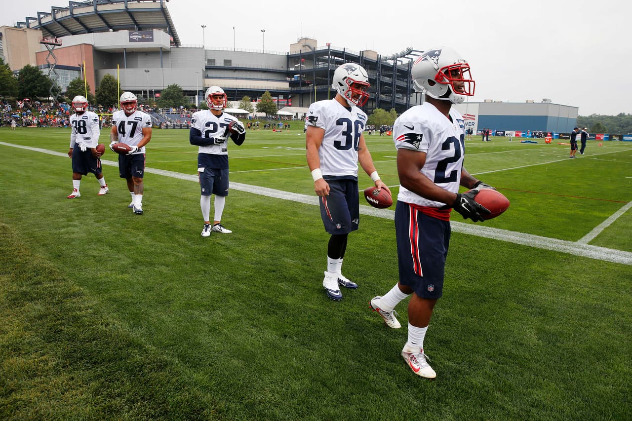 New England Patriots running backs, from left, Brandon Bolden (38), Joey Iosefa (47), D.J. Foster (27), Tyler Gaffney (36) and James White (28) on the field during an NFL football training camp practice Friday, July 29, 2016, in Foxborough, Mass. (AP Photo/Michael Dwyer)