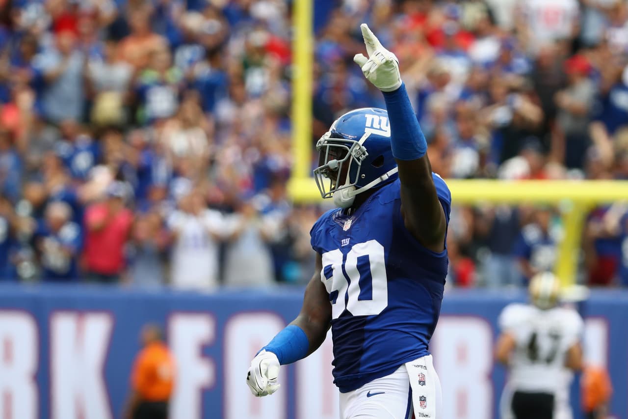 EAST RUTHERFORD, NJ - SEPTEMBER 18: Jason Pierre-Paul #90 of the New York Giants celebrates a touchdown by Janoris Jenkins #20 (not pictured) during second quarter against the New Orleans Saints at MetLife Stadium on September 18, 2016 in East Rutherford, New Jersey. (Photo by Al Bello/Getty Images)