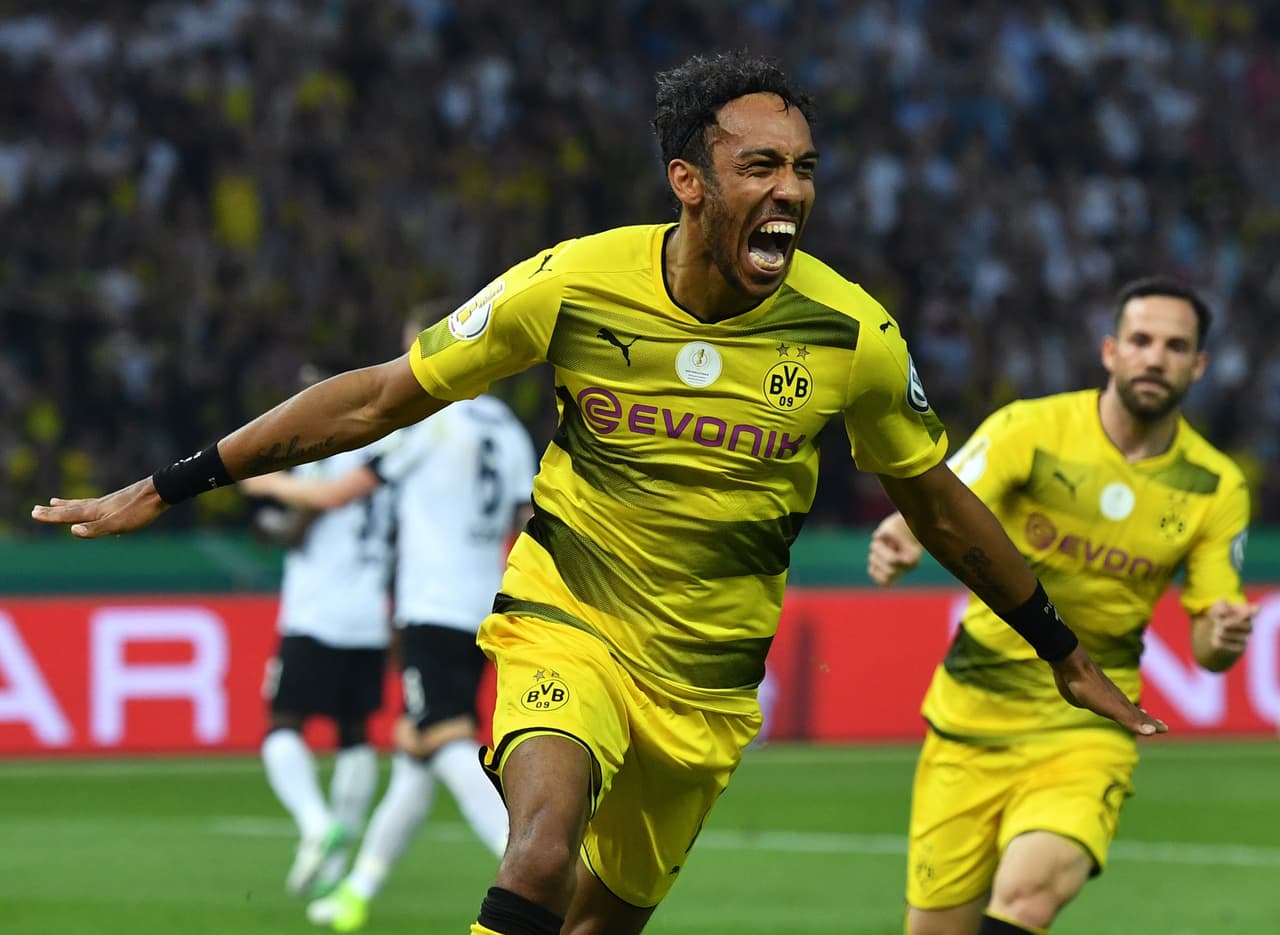 Dortmund's Gabonese forward Pierre-Emerick Aubameyang celebrate scoring from the penalty spot during the German Cup (DFB Pokal) final football match Eintracht Frankfurt v BVB Borussia Dortmund at the Olympic stadium in Berlin on May 27, 2017. / AFP PHOTO / Christof Stache / RESTRICTIONS: ACCORDING TO DFB RULES IMAGE SEQUENCES TO SIMULATE VIDEO IS NOT ALLOWED DURING MATCH TIME. MOBILE (MMS) USE IS NOT ALLOWED DURING AND FOR FURTHER TWO HOURS AFTER THE MATCH. == RESTRICTED TO EDITORIAL USE == FOR MORE INFORMATION CONTACT DFB DIRECTLY AT +49 69 67880 / (Photo credit should read CHRISTOF STACHE/AFP/Getty Images)