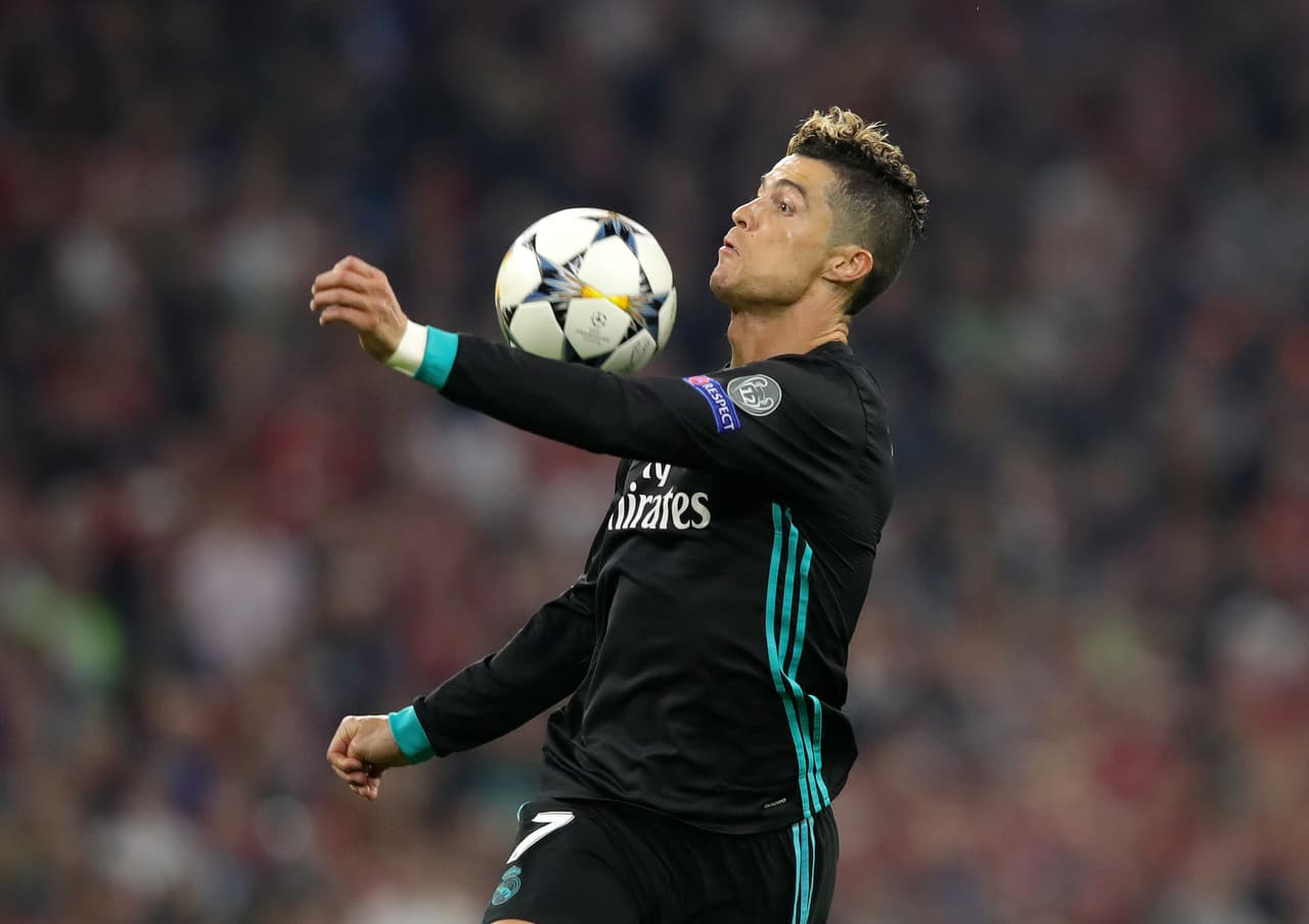 MUNICH, GERMANY - APRIL 25: Cristiano Ronaldo of Real Madrid controlls the ball in the build up to him scoring a goal which is later dissalowed for offside during the UEFA Champions League Semi Final First Leg match between Bayern Muenchen and Real Madrid at the Allianz Arena on April 25, 2018 in Munich, Germany. (Photo by Alexander Hassenstein/Bongarts/Getty Images)