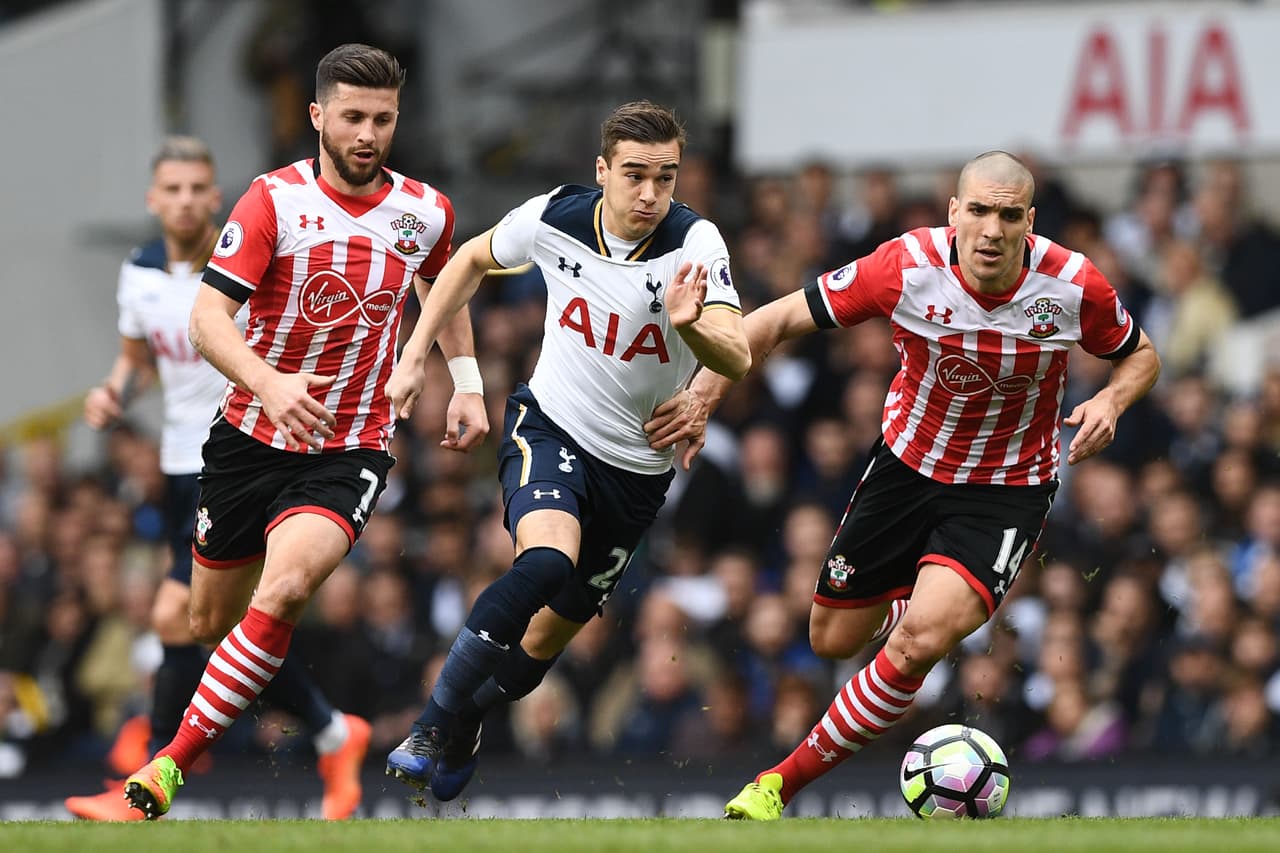 Southampton's Irish striker Shane Long (L), Tottenham Hotspur's English midfielder Harry Winks (C) and Southampton's Sepanish midfielder Oriol Romeu run for the ball during the English Premier League football match between Tottenham Hotspur and Southampton at White Hart Lane in London, on March 19, 2017. / AFP PHOTO / Justin TALLIS / RESTRICTED TO EDITORIAL USE. No use with unauthorized audio, video, data, fixture lists, club/league logos or 'live' services. Online in-match use limited to 75 images, no video emulation. No use in betting, games or single club/league/player publications. / (Photo credit should read JUSTIN TALLIS/AFP/Getty Images)