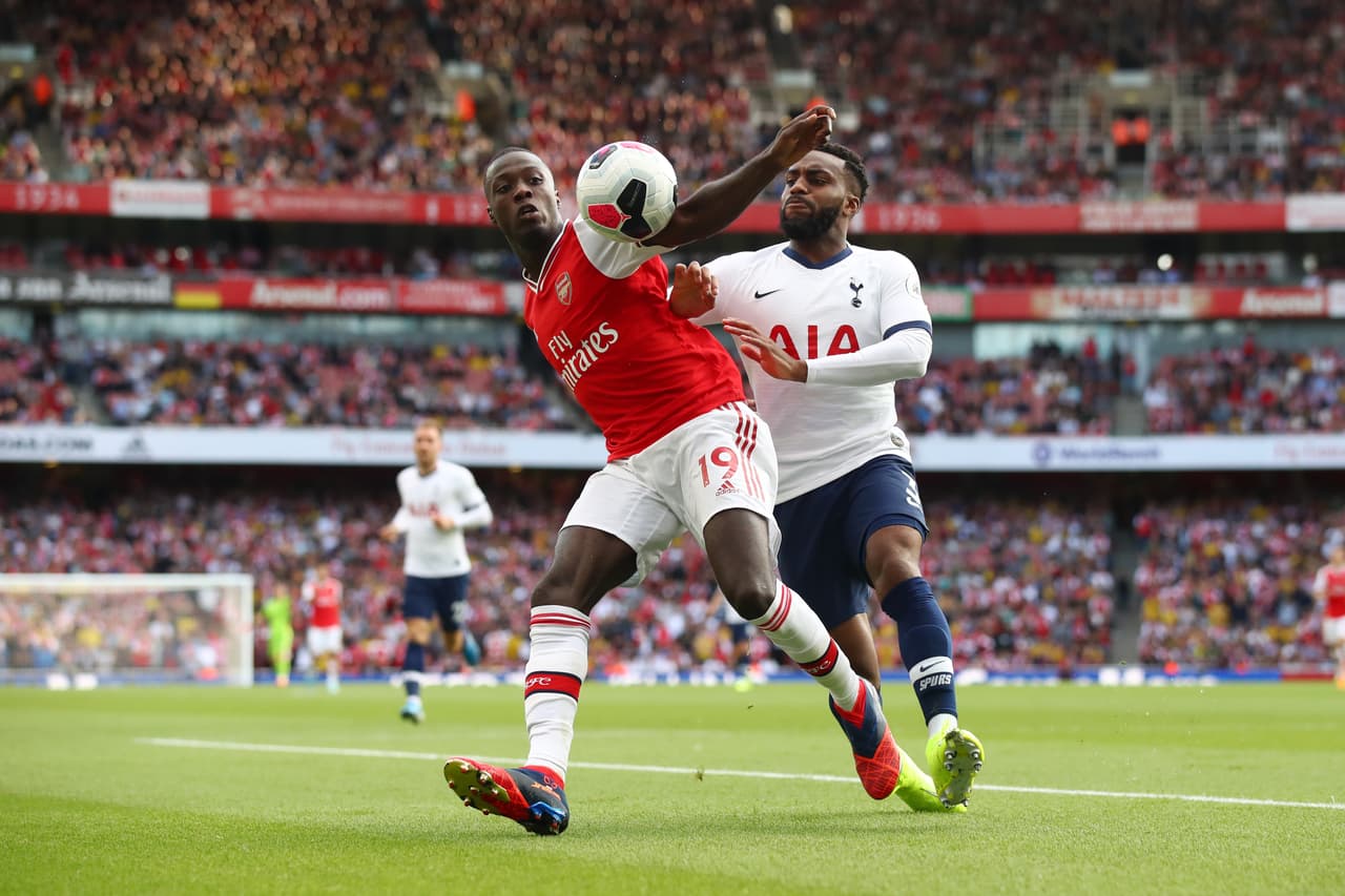 Nicolas Pepe de Arsenal y Danny Rose de Tottenham.