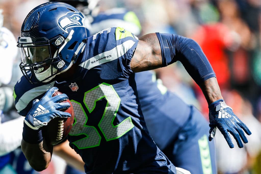 SEATTLE, WA - SEPTEMBER 23: Running Back Chris Carson #32 of the Seattle Seahawks runs against the Dallas Cowboys at CenturyLink Field on September 23, 2018 in Seattle, Washington. (Photo by Otto Greule Jr/Getty Images)